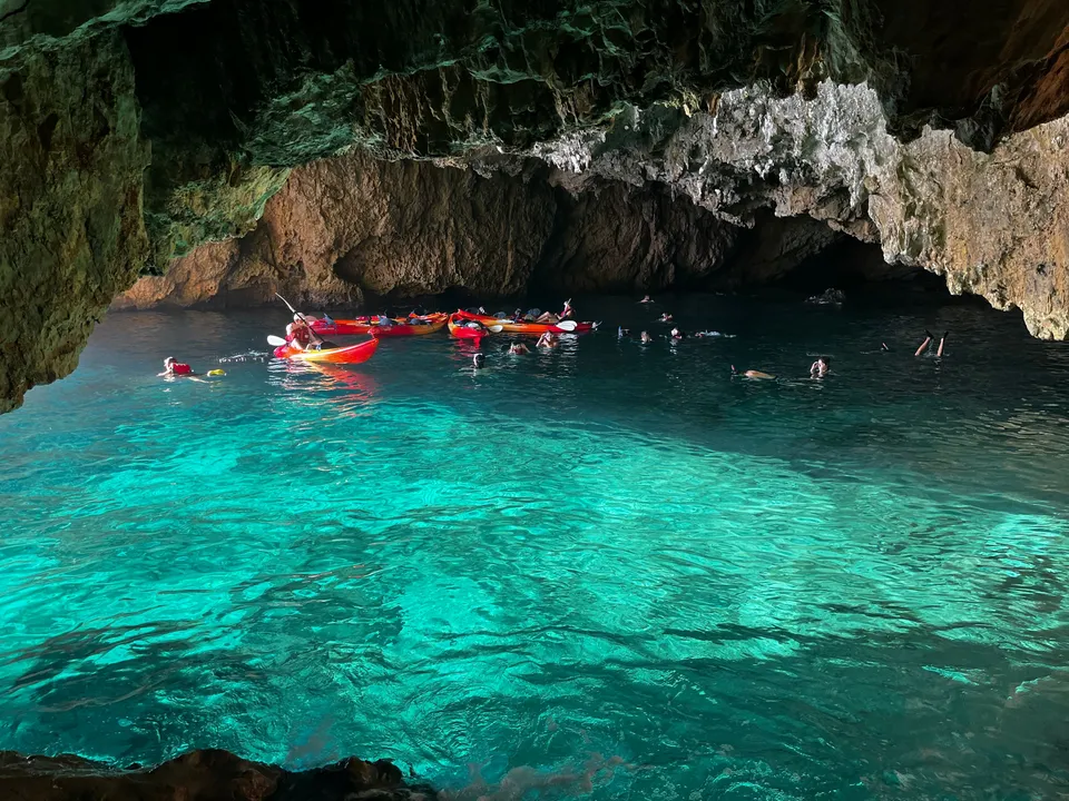 Kayaks in the turquoise water of Cala en Caló, Jávea